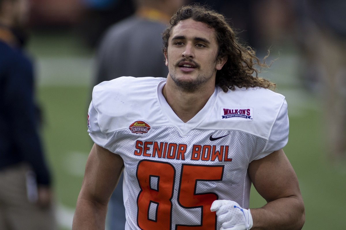 Feb 1, 2022; Mobile, AL, USA; American tight end Greg Dulcich of UCLA (85) jogs off the field after American practice for the 2022 Senior Bowl at Hancock Whitney Stadium.